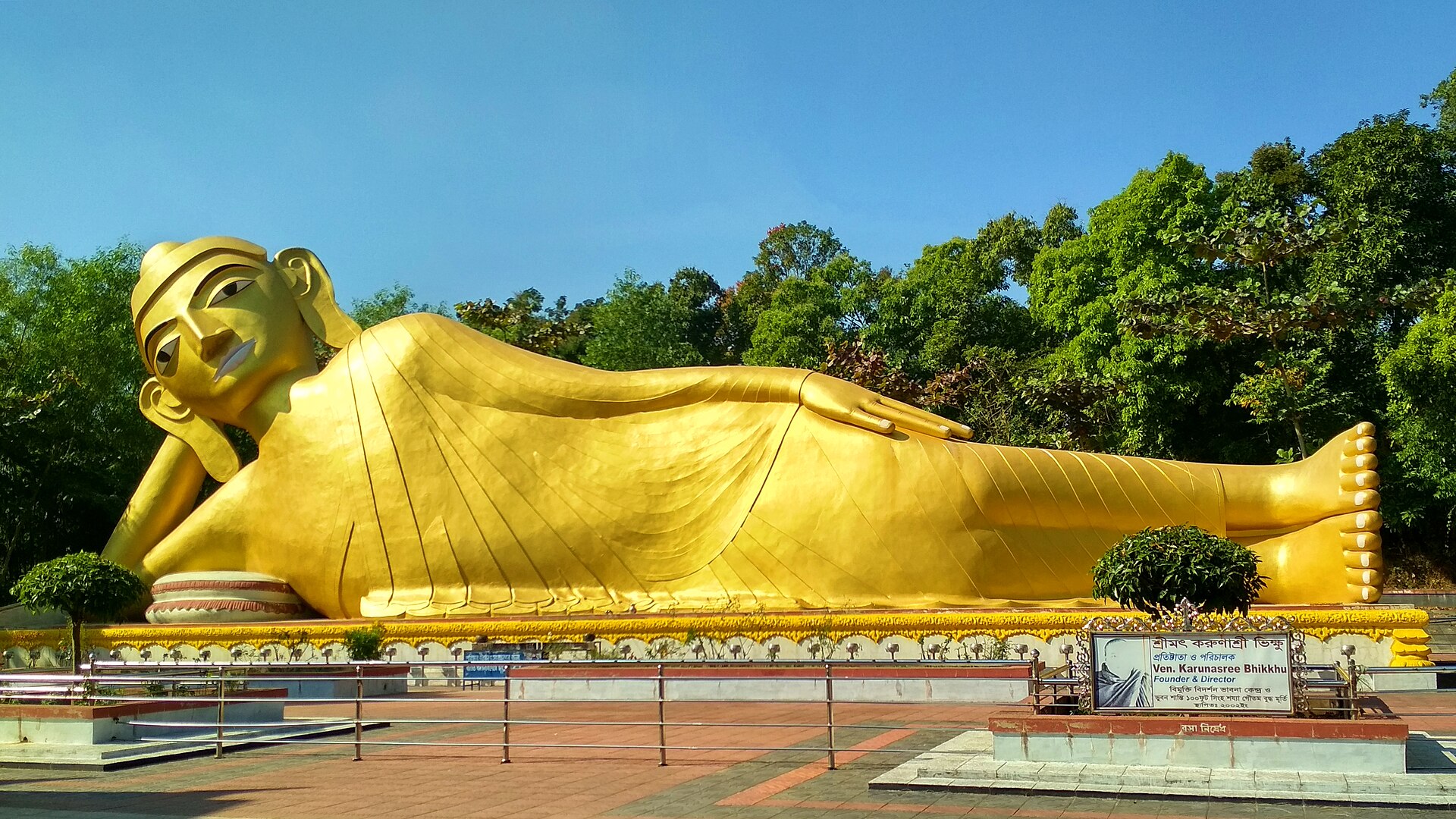 A golden reclining Buddha statue at Kaba Aye Pagoda in Yangon represents stillness and is part of exploring Indian culture.